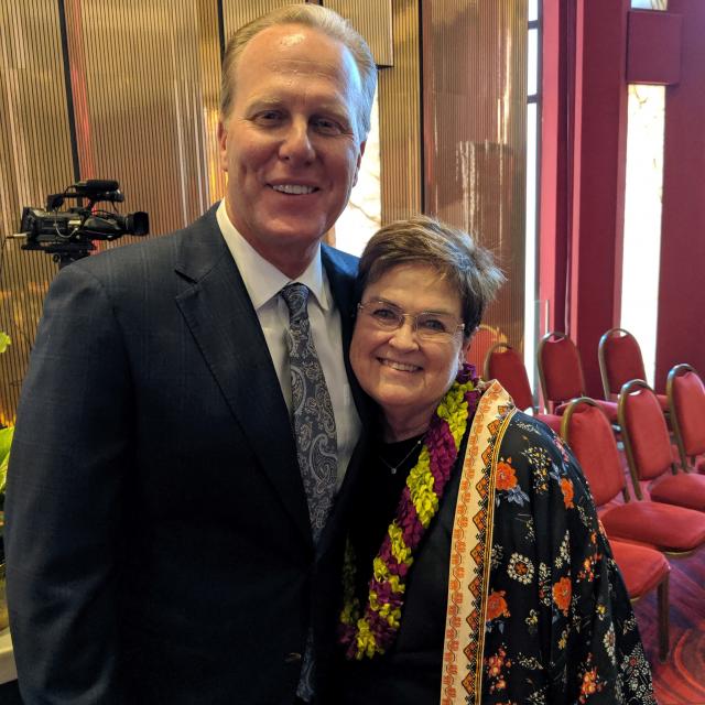 Mayor Kevin Faulconer poses with Carolyn Satter at her retirement event.
