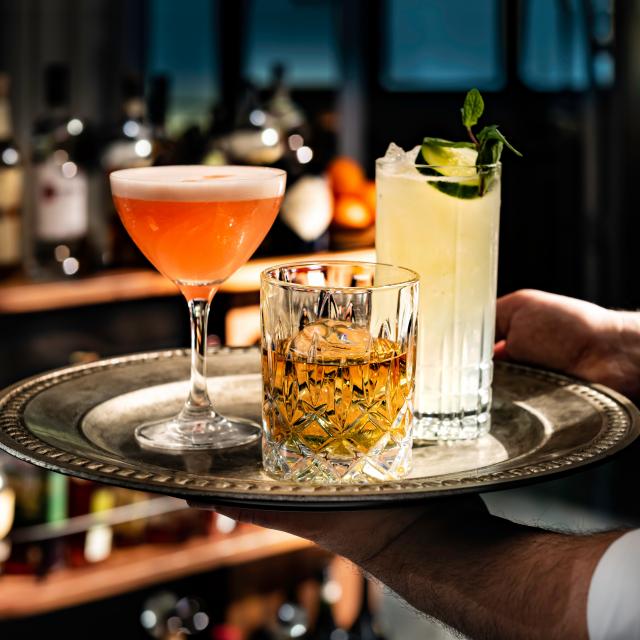 Loaded Tray of Cocktails Carried by Server